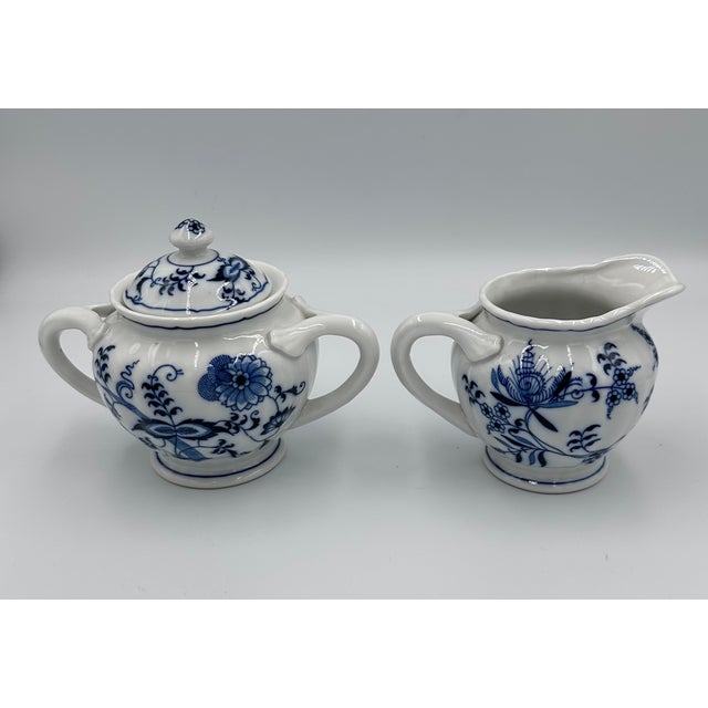 Discover the timeless elegance of this charming 1950's Vintage Blue Danube Blue Onion Sugar and Creamer Set! This...