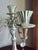Vintage mid century five arm candelabra with ornate Rococo and Victorian style design. Silver tone metal with scrolled...