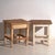 A pair of antique bedside tables in pine wood, with a square top and four tapered legs tied by box stretchers. They...