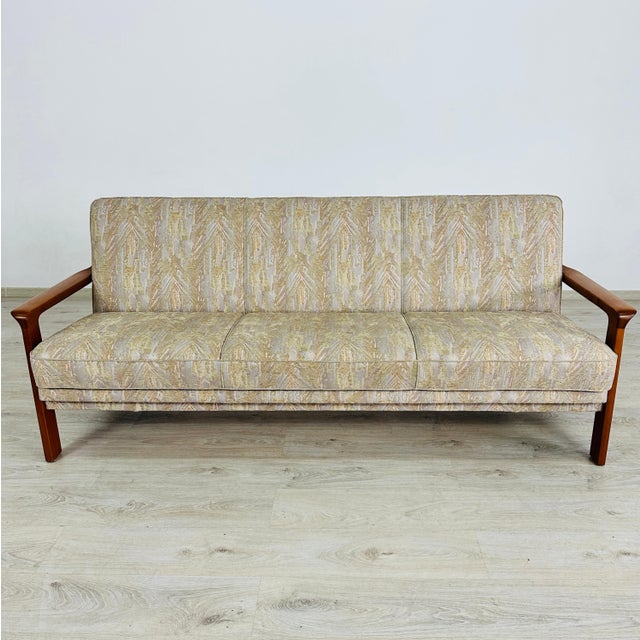 Dimensions: H 32” x W 79.7” x D 30” x SH 18” Vintage Danish three-seater sofa with teak frame and upholstered in original...
