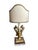 Gold fragments depict birds on either side of the lamp. The base of the lamp is acrylic.