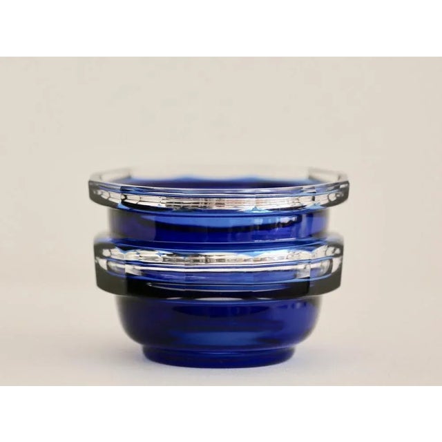 Deep cobalt blue cut to clear sculpted crystal work with mercury decor on the faceted contour. Work by Val-Saint-Lambert,...