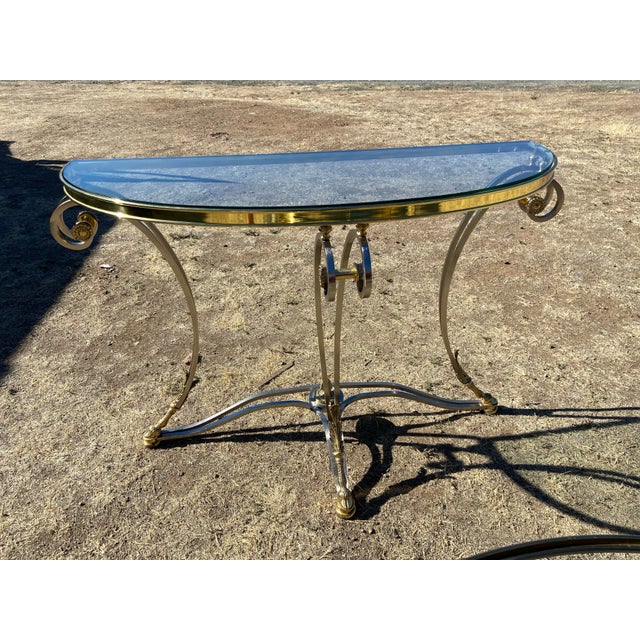 This vintage LaBarge Steel & Brass Hollywood Regency Jansen Style glass top coffee table and hall side half moon table...