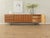 Classic sideboard from the 1960s. High-quality body in walnut veneer with three drawers, three doors, two shelves and new...