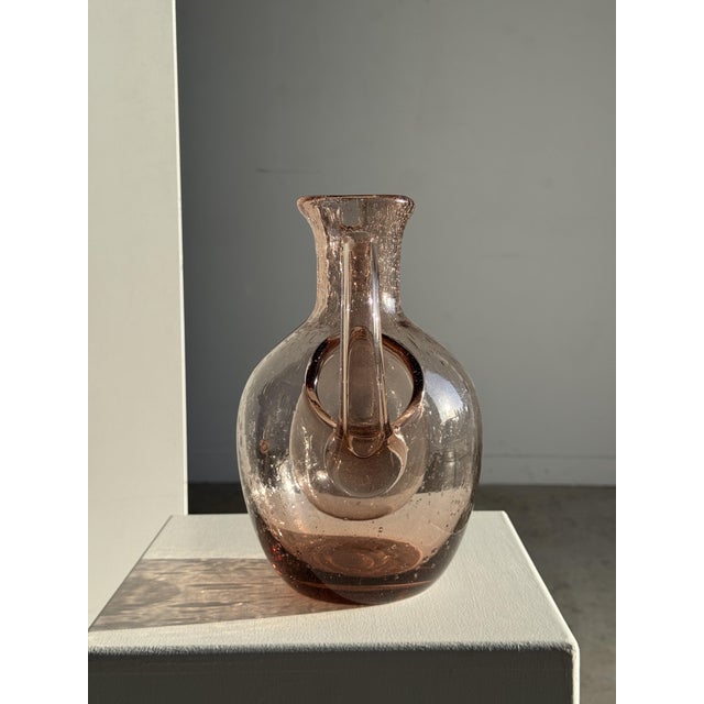 Large violet carafe with ice compartment from the Biot glassworks. Founded in 1956 in Provence, the Biot glassworks is...