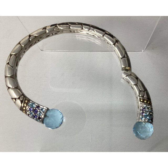 This bracelet is from the Kali Lavafire Sea Color Collection of John Hardy. There are round briolette faceted swiss blue...