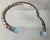 This bracelet is from the Kali Lavafire Sea Color Collection of John Hardy. There are round briolette faceted swiss blue...