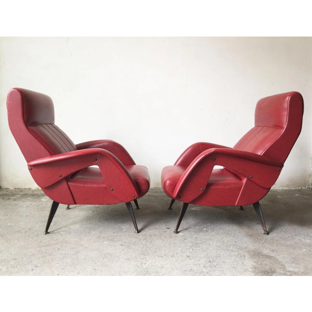 Set of Mid-Century Red Faux Leather and Iron Lounge Chairs Attributed to Carlo de Carli, in Very Good conditions. Designed...