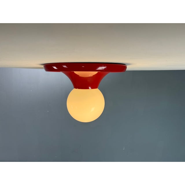 Iconic mid-century “light ball” wall or ceiling lamp designed by achille castiglioni and manufactured by flos in italy...