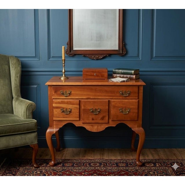 Add a touch of timeless sophistication to your home with this exceptional Queen Anne Lowboy. Originally sold as a high-end...