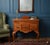 Add a touch of timeless sophistication to your home with this exceptional Queen Anne Lowboy. Originally sold as a high-end...