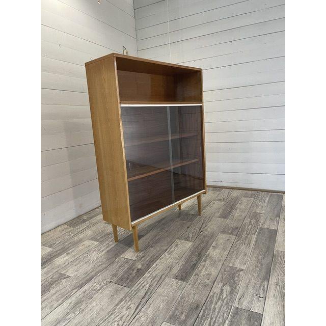 Vintage Book Case / Showcase by Novy Domov, 1975 In superb condition with glass sliding doors Original company sticker on...