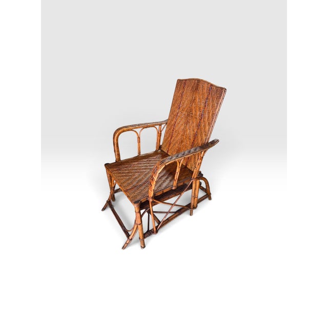 Exceptional antique European handwoven wicker and rattan reclining armchair, dating to approximately 1890–1915. This...