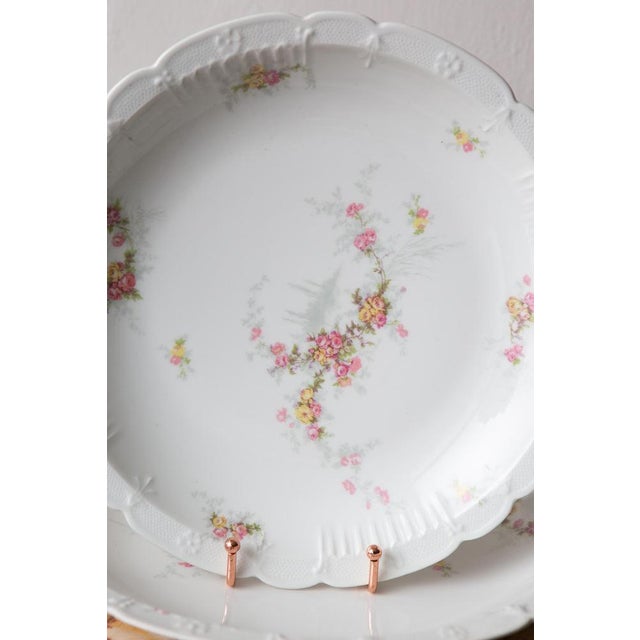 They measure: 29 cm and 5 cm high; 29 cm and 3.5 cm high; 32 cm and 4 cm high. Porcelain of the finest quality signed J....