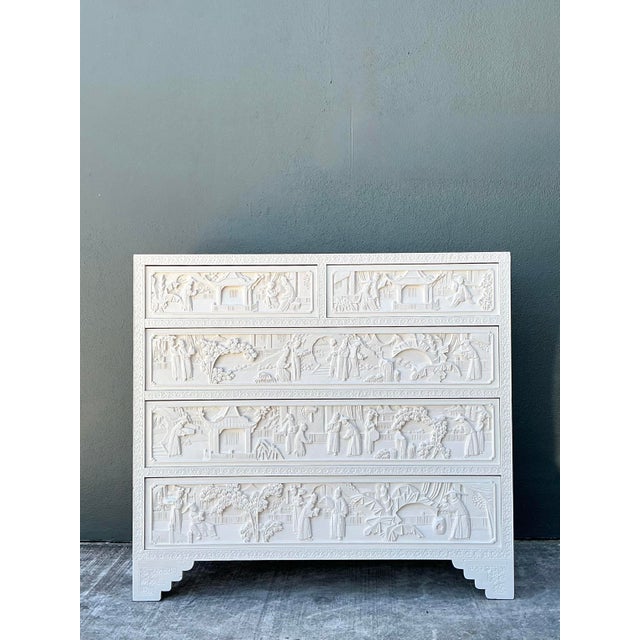 Elevate your interior with this remarkable Todd Hase carved relief dresser, a masterpiece of contemporary Chinoiserie...