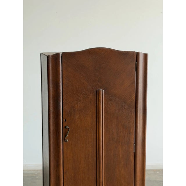 W30 D17 H63.5 Shelf Spaces W18 + W9 D12 H10 This charming Art Deco Armoire has been fully refinished in a rich medium...