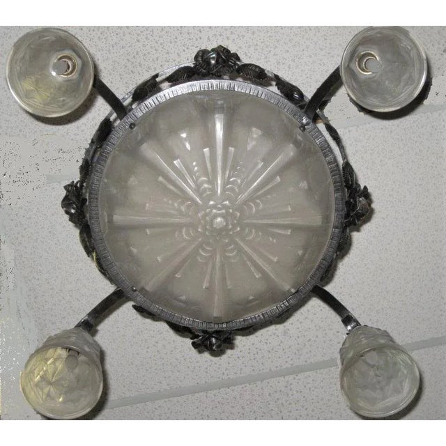 French Art Deco frosted art glass chandelier. Central coupe with four matching tulips suspended from the original hand-...