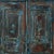 Antique Indian Small Painted Teakwood Armoire, with deeply beveled carved panels, bracket plinth, and much of its old blue...