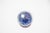 The exterior is finished in a mottled and streaked blue lustre glaze, with purple, blue, and violet tones interplaying in...