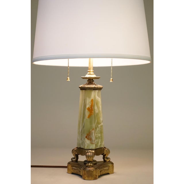 A sophisticated and elaborately detailed Green & Rust Onyx Marble & Brass French Art Deco Empire Neoclassical table lamp...