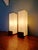 Pair of rectangular teak wall sconces with satin white opaline glass shades, designed by louis kalff for philips, auray...