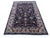 Persian Kashan rug, hand-knotted in Pakistan from 100% wool. Measuring 5’6” x 7’9”, the rug features an elegant all-over...