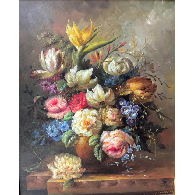 A richly detailed vintage floral still life oil on canvas, presented in an ornate gilt wood frame. The composition...