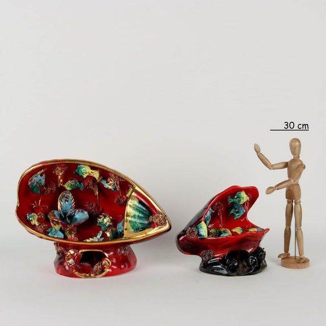 Pair of marine-themed sculptures in polychrome ceramic prepared for electrification. Imprinted or painted manufacturer's...