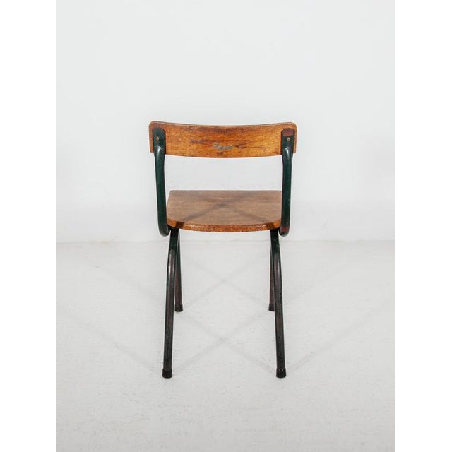This authentic 1950s industrial school chair is a classic piece of Belgian design history, created by the renowned...