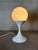 A solid tulip table lamp in metal and opaline. The edge of the tulip holder shows little noticeable rust (see photos)....