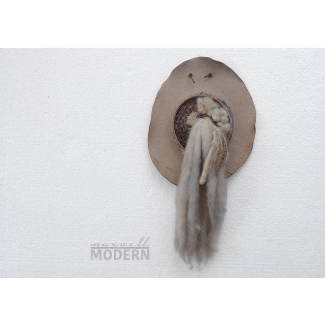Unique vintage 70s era boho wall sculpture made of ceramic, fabric, fiber and a few feathers. On the smaller size, with a...