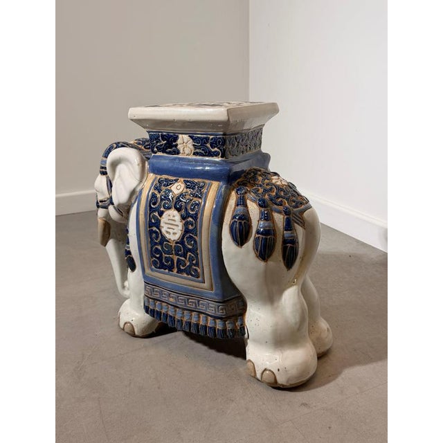 Decorative ceramic elephant stool featuring intricate blue and white ornamental detailing with an Asian inspired design....