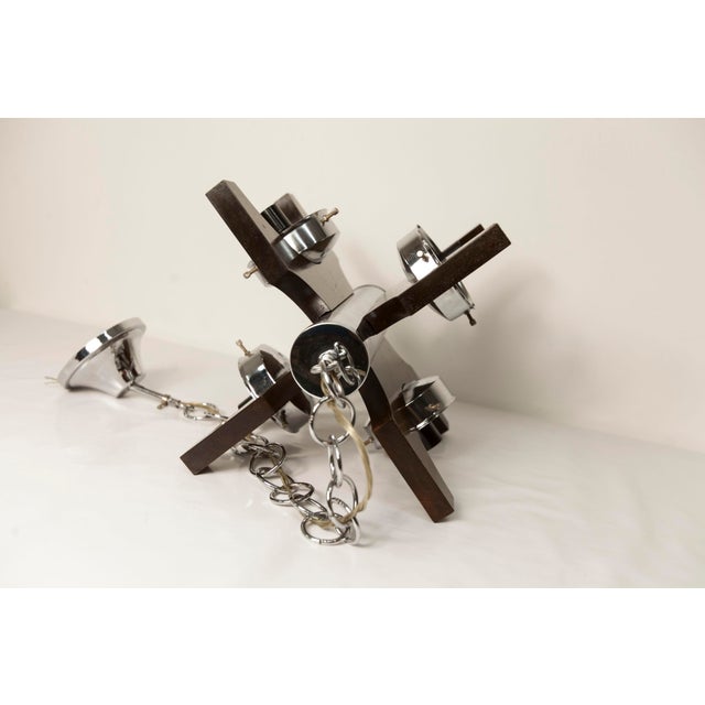 Mazzega Murano 4-ball teak chandelier, 1960s. This chandelier has been completely disassembled, cleaned, and restored. It...