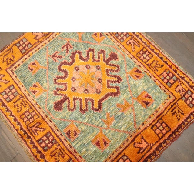 A small antique square early 20th century Oushak Rug
