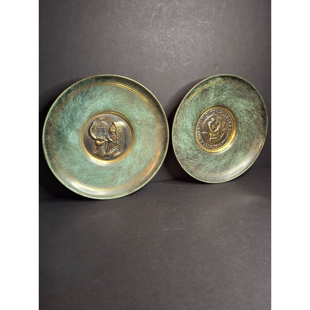 This is an authentic matched pair of mid-century Modernist cast bronze and chemical-verdigris decorative wall plates...