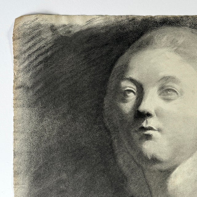 A French academic study depicting the bust of an eighteenth century woman, rendered in charcoal on cream wove paper. This...