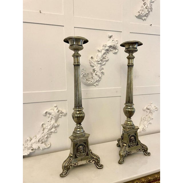 Large pair of antique victorian quality brass candlesticks having circular tops above a reeded column supported by unusual...