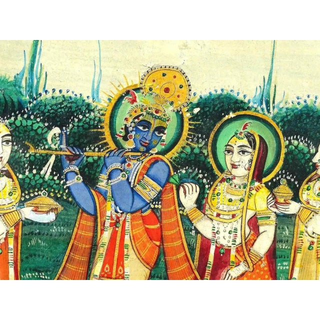 An antique Indian Mughal Art mixed media, gouache and gold leaf, miniature painting. The artwork depicts a scene with...