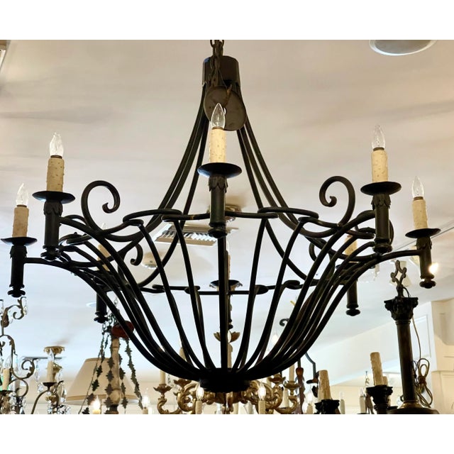 Ebanista Spanish Colonial Wrought Iron Chandelier. Beautifully hand wrought iron and 8 lights. Includes original chain and...