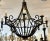 Ebanista Spanish Colonial Wrought Iron Chandelier. Beautifully hand wrought iron and 8 lights. Includes original chain and...
