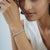 This 7-inch vintage-style eternity bracelet features a single continuous row of natural white zircon gemstones in a 925...
