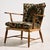 Walnut armchair from the 1950s, designed by Austrian architect and designer Anna-Lülja Praun. The chair features elegant...