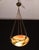 Extraordinary red alabaster pendant chandelier with black and orange antique shades in Art Deco style, circa 1940s. A...