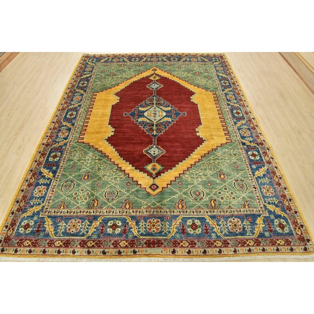 This traditional tribal Ziegler rug is hand-knotted with an all-wool pile on a cotton foundation. This rug is new and in...