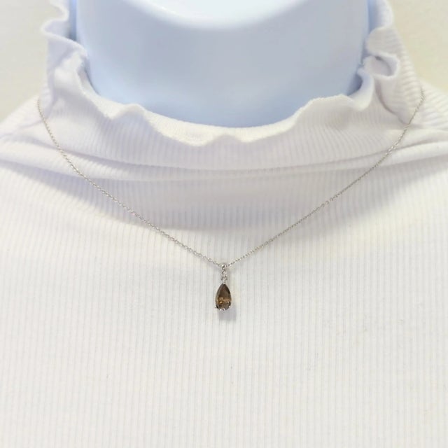 Beautiful 1.00 ct. champagne diamond pear shape in a handmade 18k white gold mounting. Length of chain is 16". Metal:...