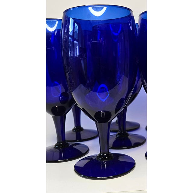 Deep, richly cobalt goblets in a fluid swedish gustovian design with a generous iced tea size would grace any table- a...