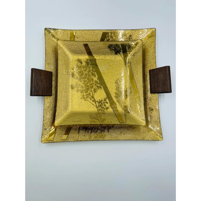 This rare set of Signed Ernest Sohn glass gold trays are indeed as beautiful as they are functional. They feature a gold...