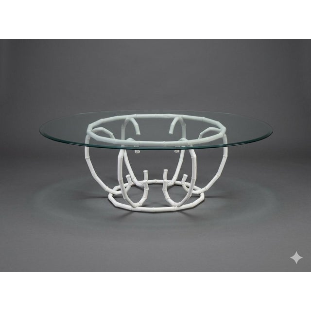 Bring classic Palm Beach elegance to your living room with this striking Mid-Century Hollywood Regency oval coffee table....
