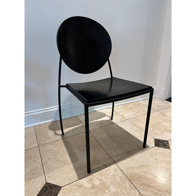 Set of 8 Memphis-style “Vik-Ter” black wood and metal side chairs by designer Dakota Jackson. The chairs feature a...