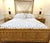 Chinese Chippendale fretwork Queen size bed frame. Attrib to Vivia del Sud. Features grasscloth and bamboo covered...